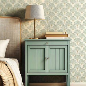 Modern bedroom with serene sage palm wallpaper, coastal design, and stylish bedside table for tranquil living.