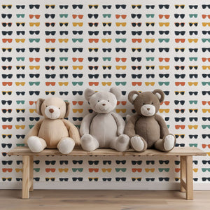 Mid-century modern pop art wallpaper with sunglasses pattern, featuring teddy bears on a bench, perfect for coastal themed rooms.