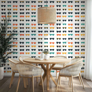 Vibrant pop art sunglasses wallpaper in mid-century modern dining room, ideal for coastal and eclectic interiors.