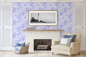 Coastal living room with Lavender Tide wallpaper featuring seaweed and coral designs in soothing lavender, creating a maritime ambiance.