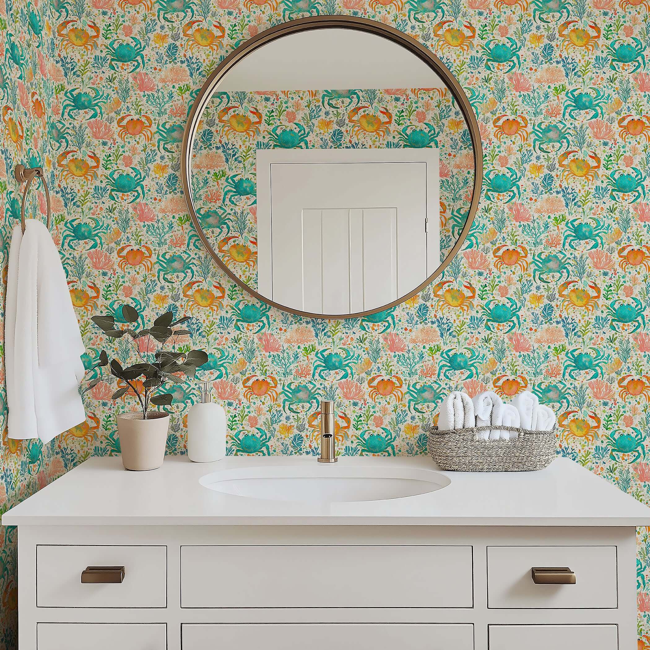 Bathroom with "Crab Cove" coastal wallpaper featuring watercolor crabs, coral, and ocean plants in vibrant blue and citrus hues.