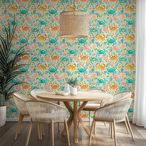 Coastal Crab Cove wallpaper featuring watercolor crabs, coral, and ocean plants in vibrant blue, coral, and citrus hues.