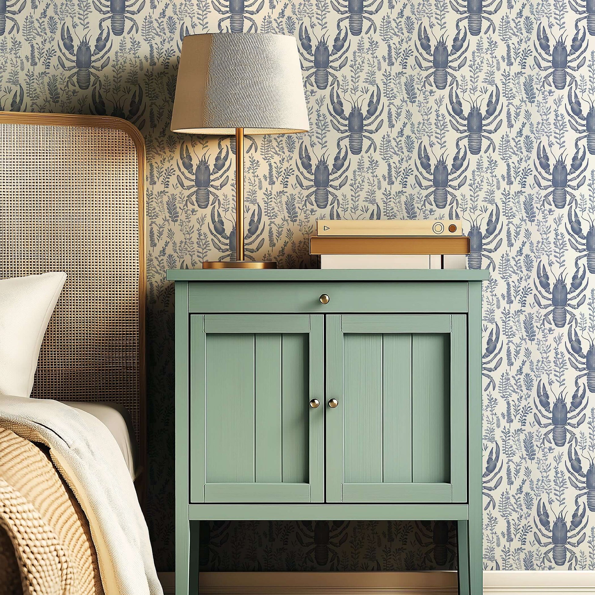 Lobster Bay coastal wallpaper with navy lobsters and botanical designs, enhancing a bedroom with marine elegance and oceanic charm.
