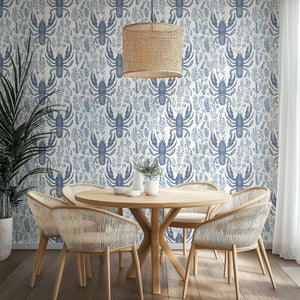 Lobster Bay wallpaper featuring navy lobsters and botanical motifs on an ivory background, enhancing a coastal dining room's marine style.