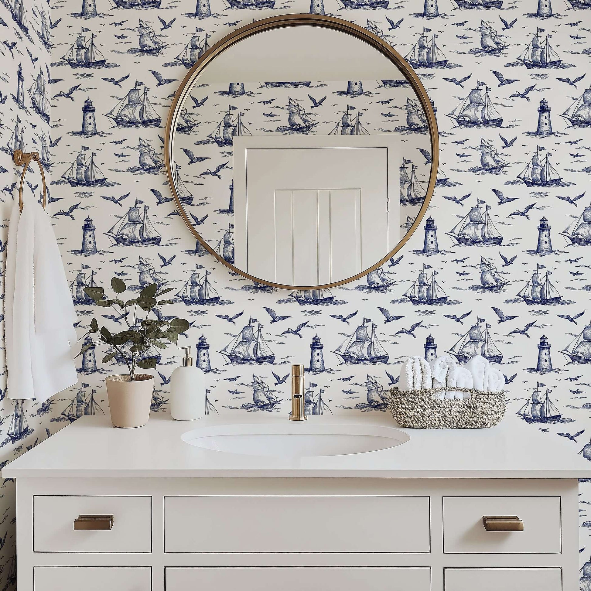 Classic bathroom with "Nautical Odyssey" wallpaper featuring navy ships, seagulls, and lighthouses, enhancing coastal elegance.