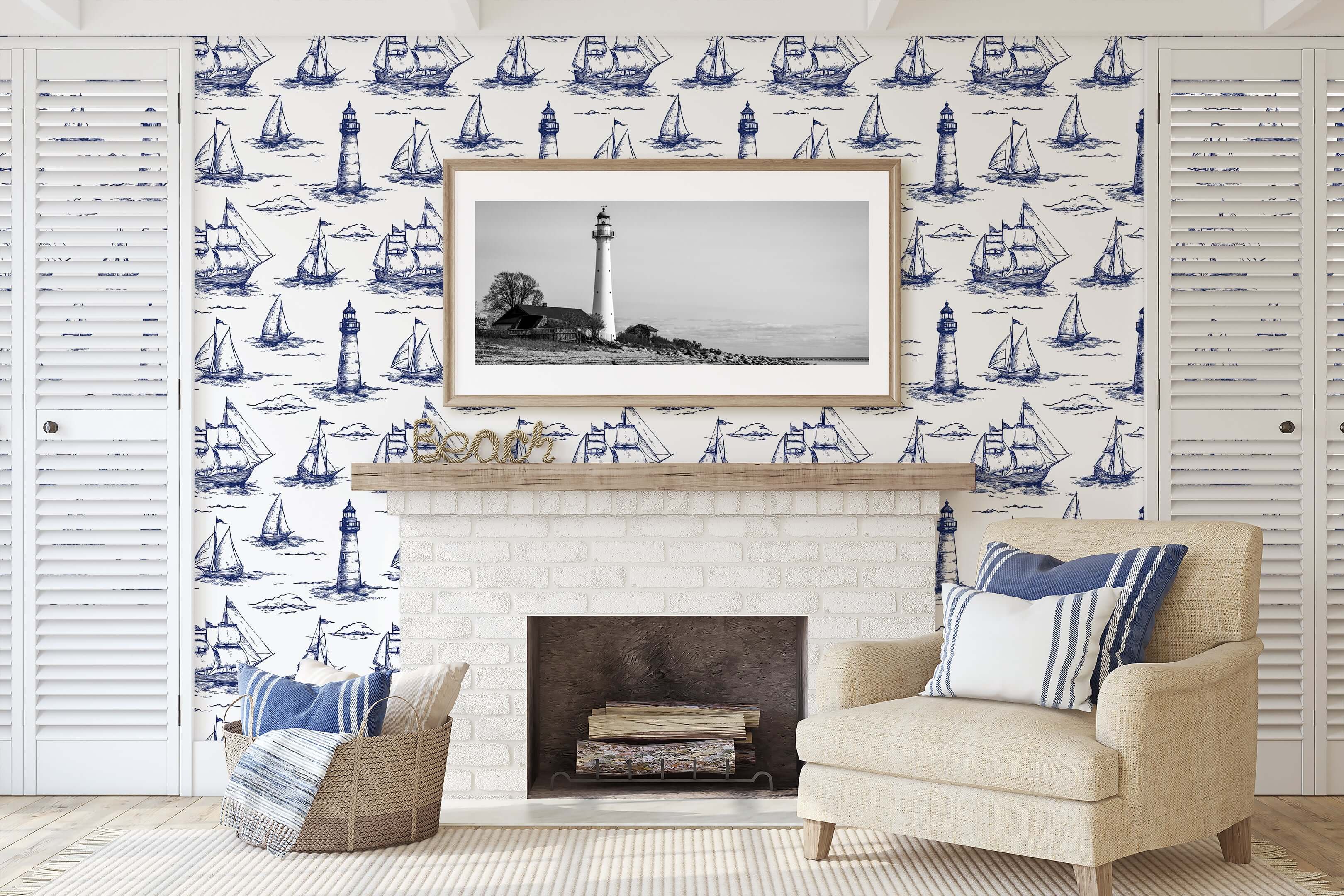 Nautical living room with Beacon Bay coastal wallpaper featuring navy sailboats and lighthouses, exuding maritime charm and ocean vibes.
