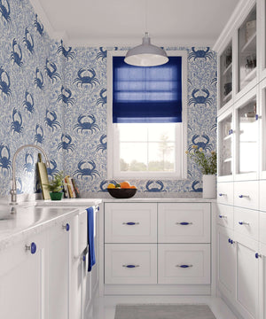 Blue Crab Botanica wallpaper featuring crabs and ocean flora in a coastal kitchen setting, adding marine elegance to the space.