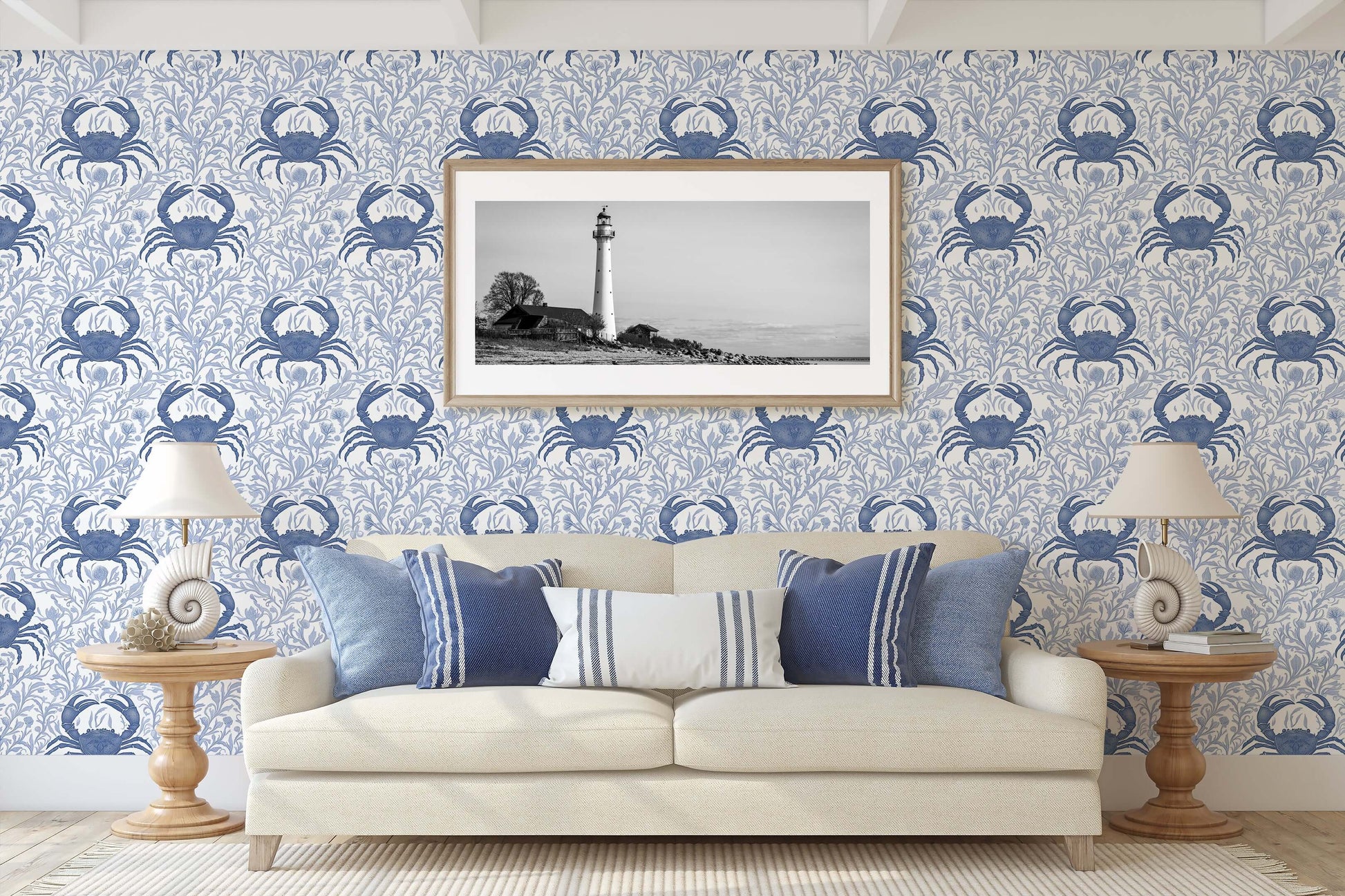 Blue Crab Botanica wallpaper with coastal crabs and ocean flora design in a nautical-themed living room with lighthouse artwork.