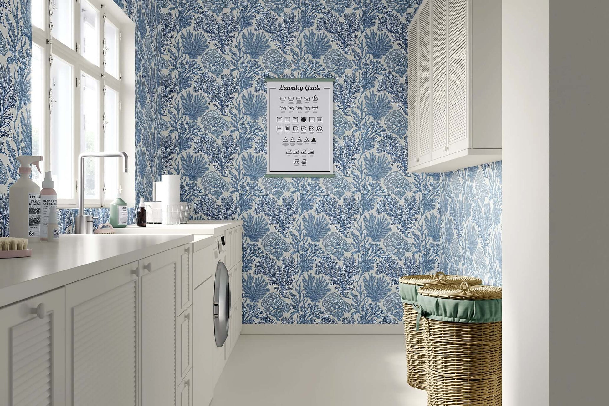 Laundry room with blue coastal "Maritime Meadow" wallpaper, featuring marine flora in soothing oceanic tones, enhancing coastal decor.