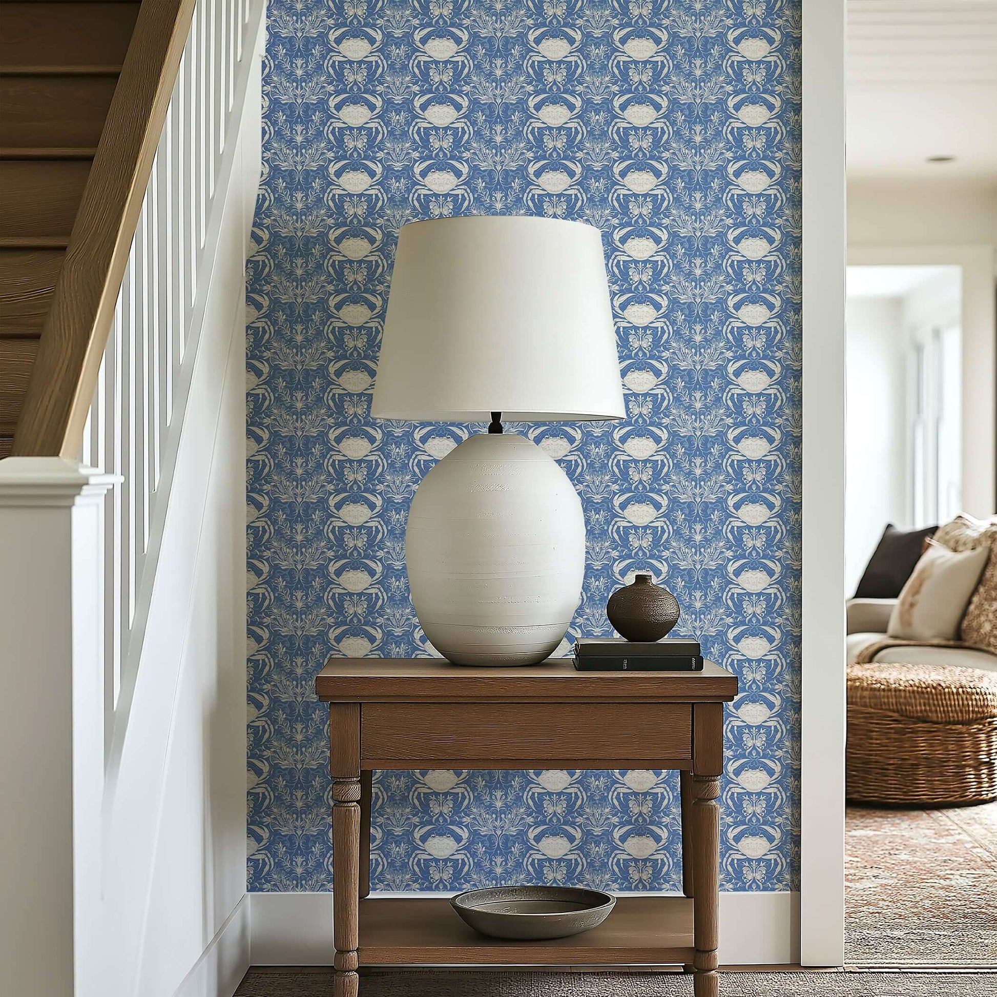 Crab Royale Damask coastal wallpaper with hand-drawn crabs and seaweed on periwinkle blue, enhancing a marine-themed room decor.