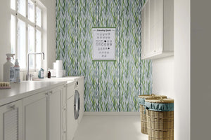 Laundry room featuring Kelp Cascade wallpaper with green ocean-inspired kelp design adding coastal elegance to the space.