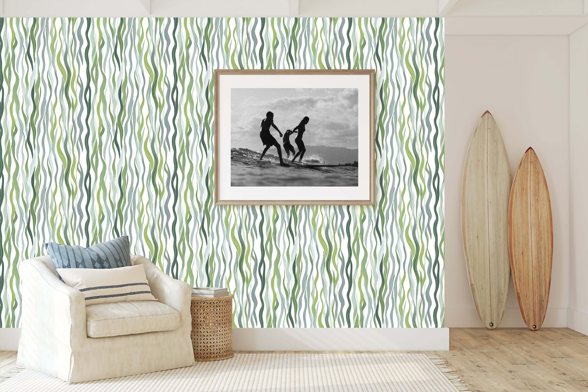 Kelp Cascade ocean-themed coastal wallpaper with green strands adding marine elegance to living room decor with framed photo and surfboards.