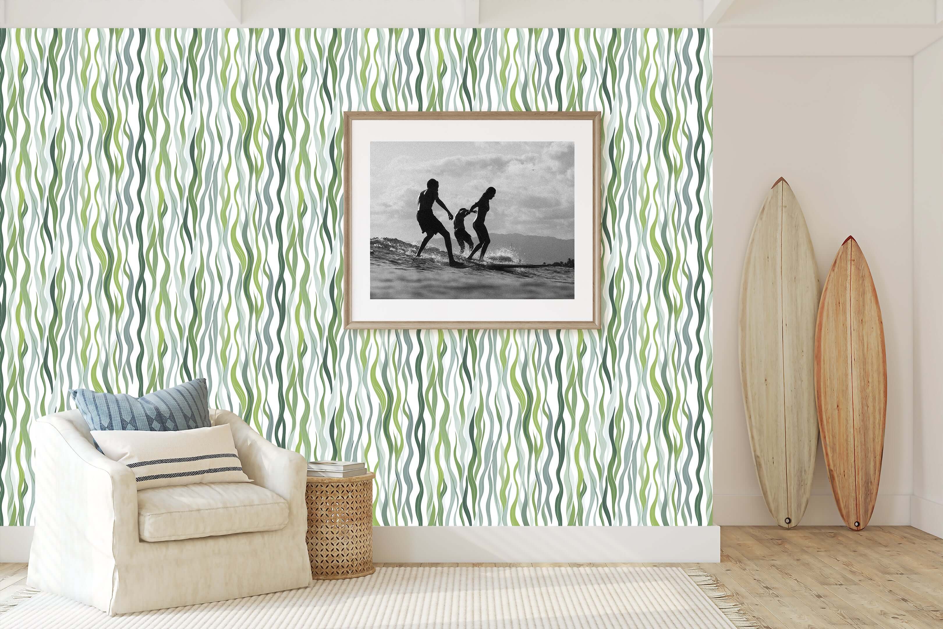 Kelp Cascade ocean-themed coastal wallpaper with green strands adding marine elegance to living room decor with framed photo and surfboards.