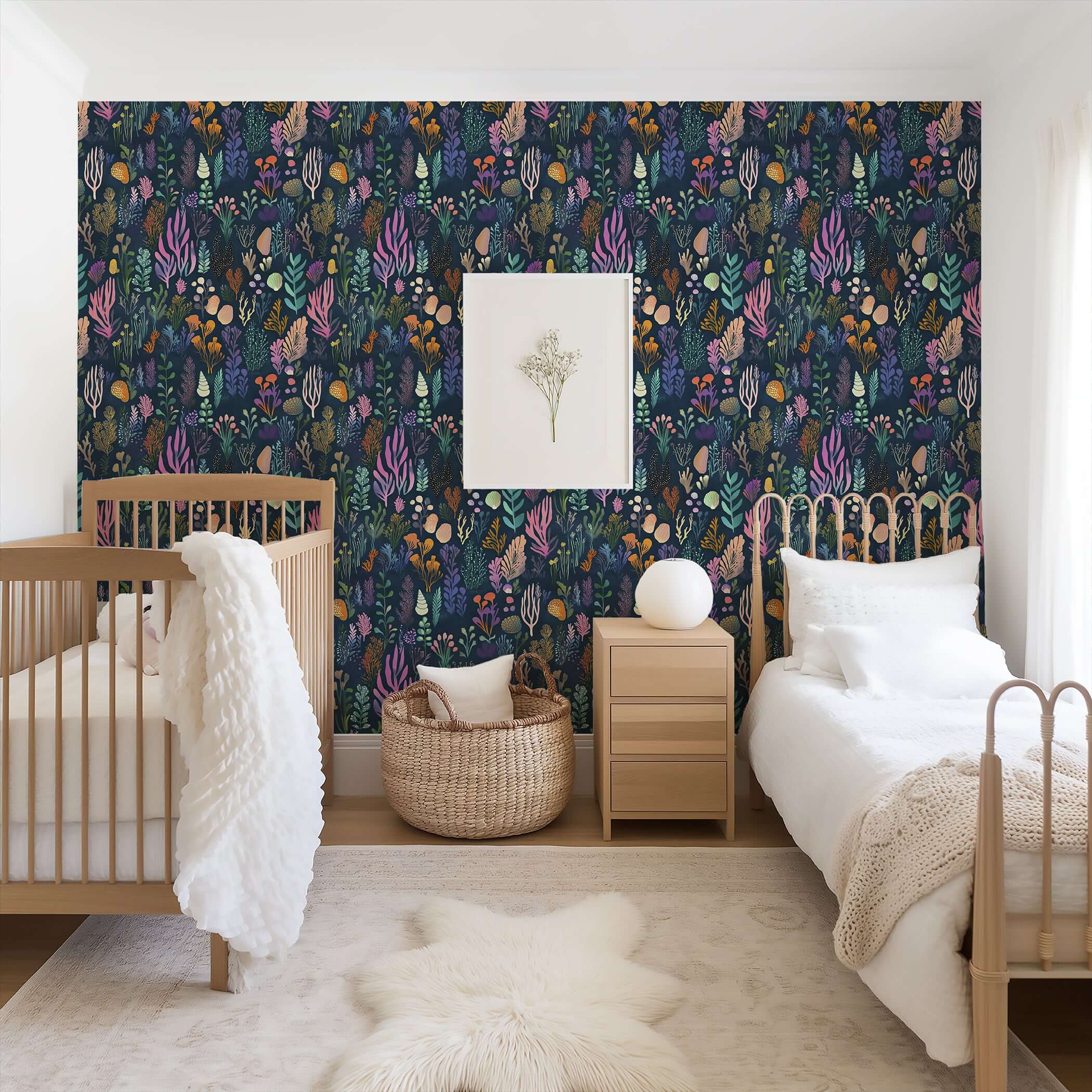 Nursery with Enchanted Ocean Flora wallpaper, featuring vibrant marine botanicals in violet, coral, and gold on a navy backdrop.