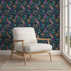 Vibrant Enchanted Ocean Flora wallpaper featuring seaweeds, corals, and marine botanicals on navy backdrop in coastal room.