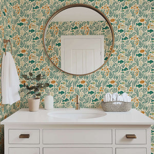 Bathroom with Sea Garden Bliss wallpaper featuring fish, coral, and seaweed in teal and green, creating a coastal mid-century modern vibe.