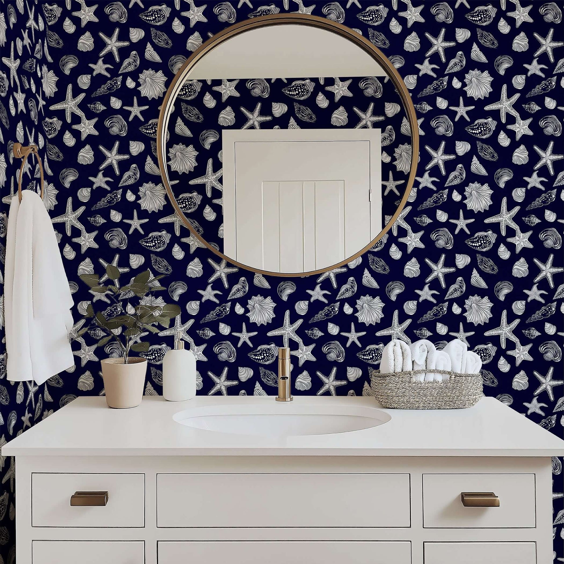 Bathroom with Navy Shore Treasures wallpaper featuring white starfish and seashells on a navy background, enhancing coastal decor.