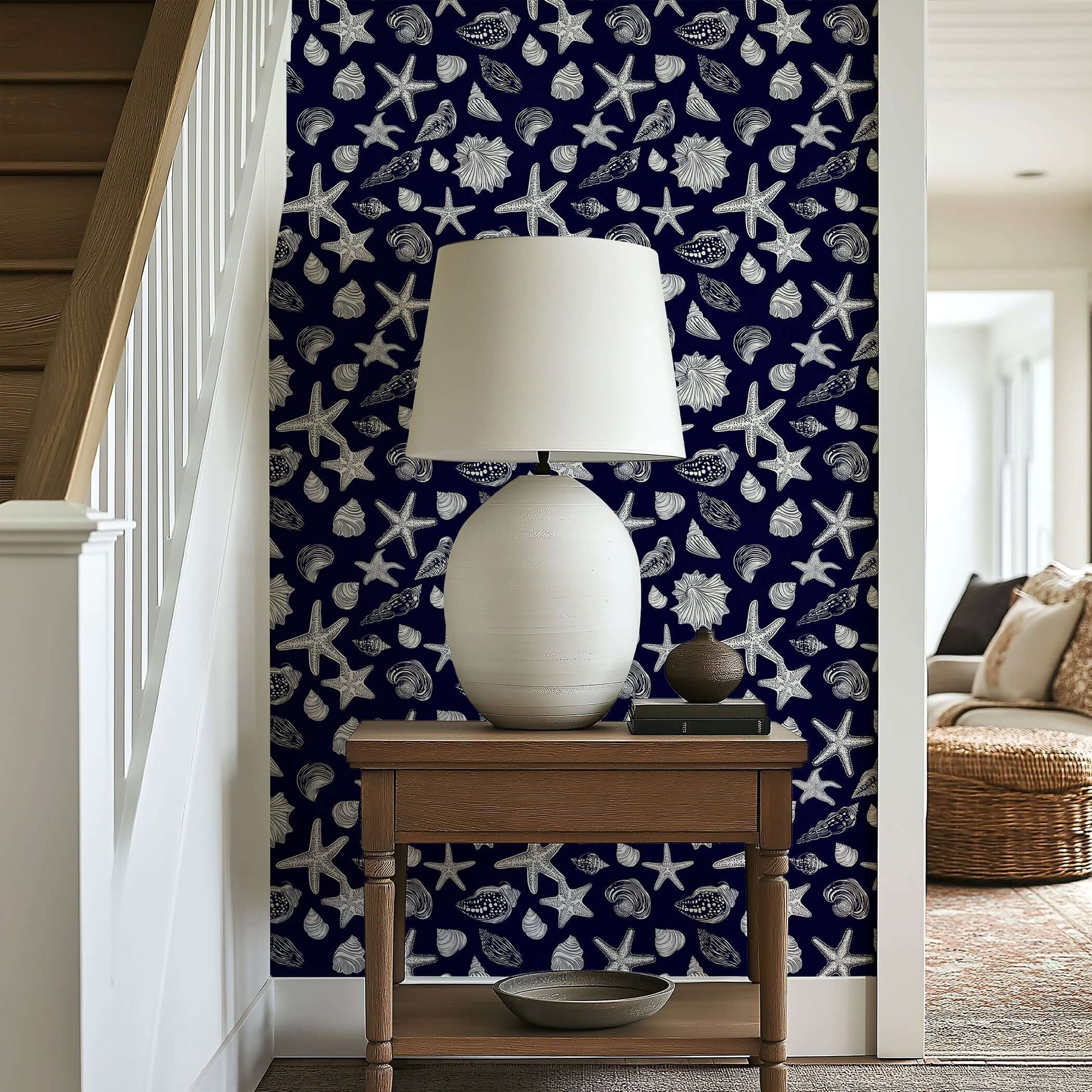 "Navy Shore Treasures" wallpaper with white starfish and seashells on a navy background, perfect for coastal decor.