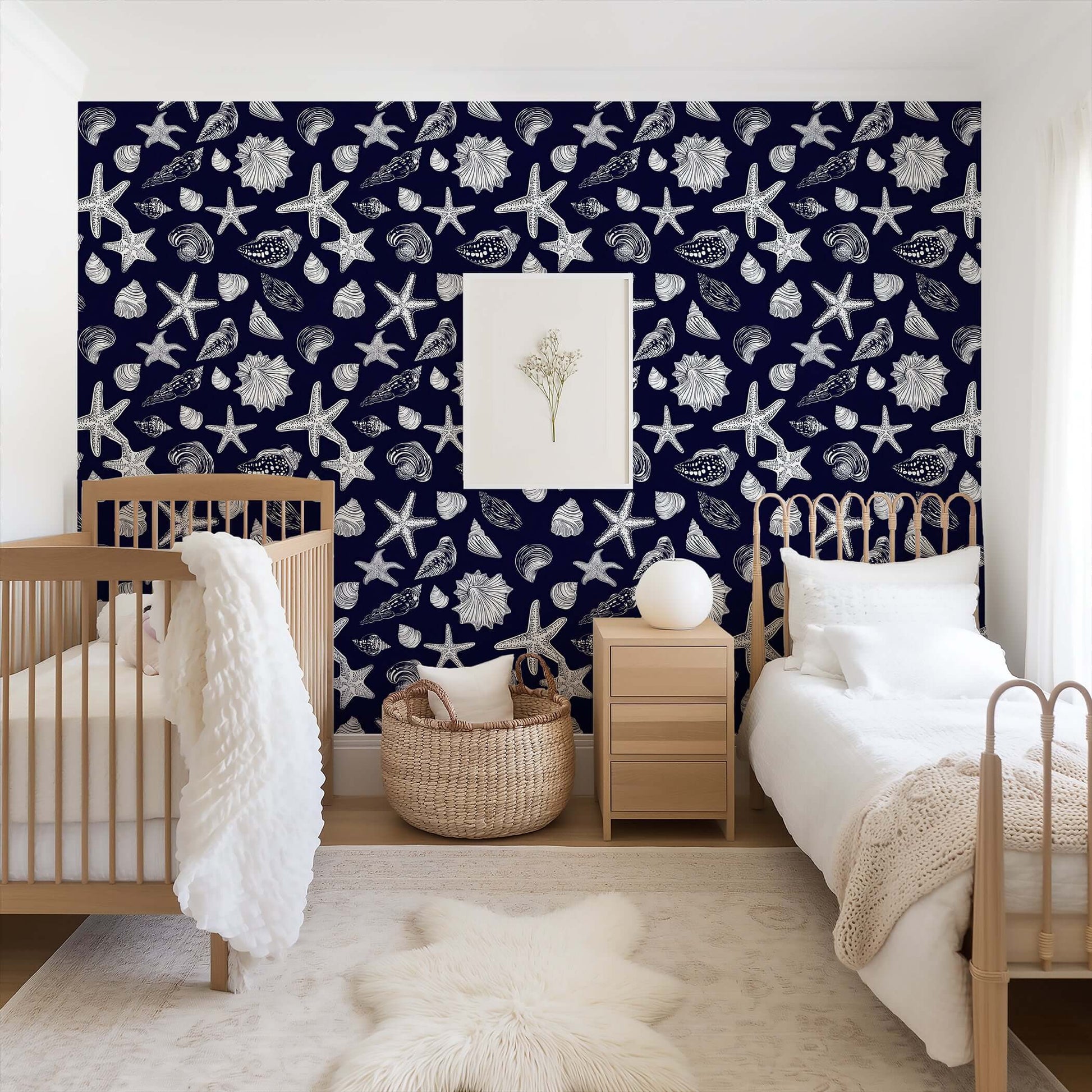 Coastal navy wallpaper with white starfish and seashells in a beach-themed bedroom, adding nautical elegance and sophistication.