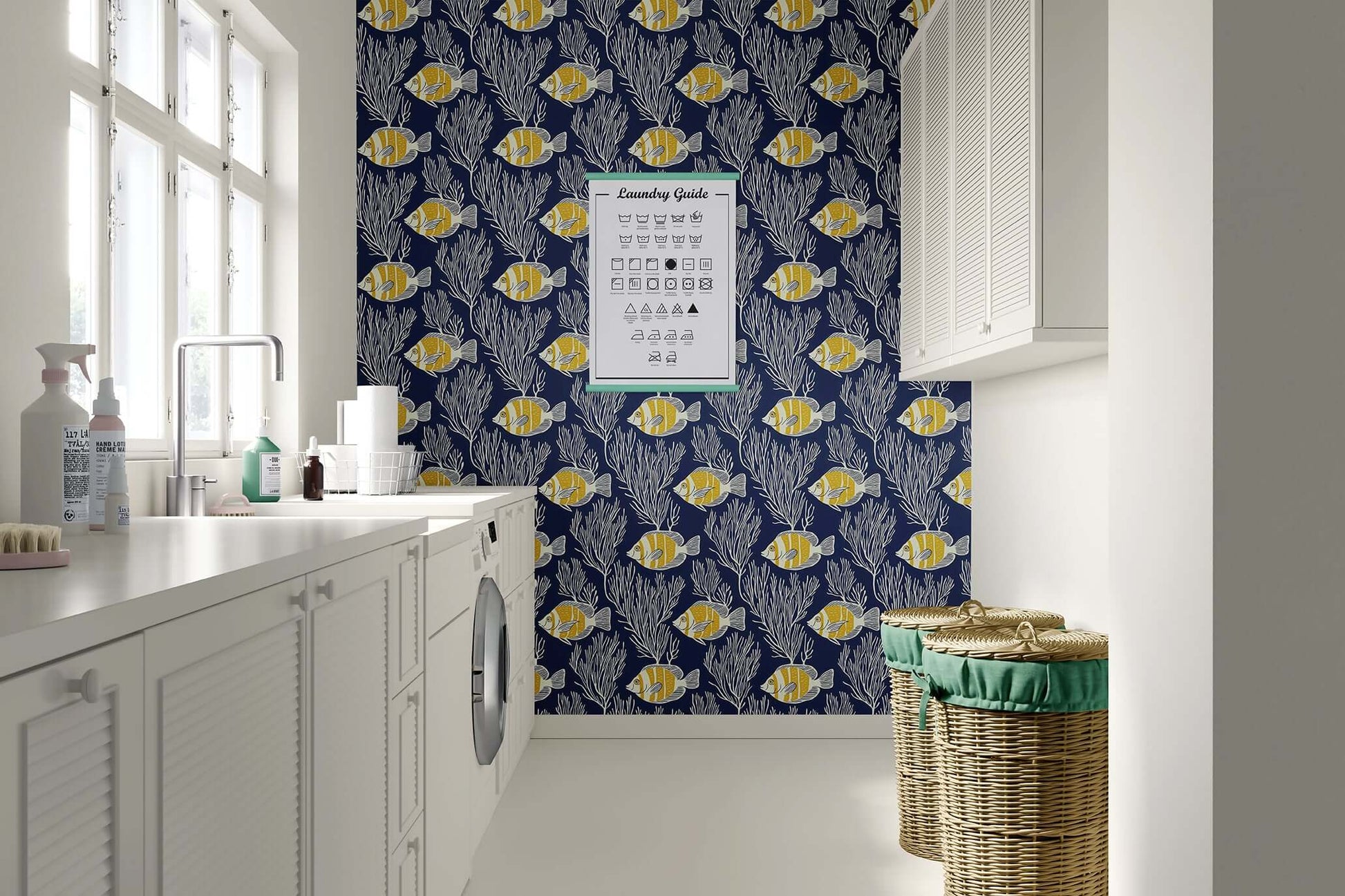 Laundry room with Deep Blue Tropics wallpaper featuring yellow striped fish, coastal coral, and seaweed against a navy background.