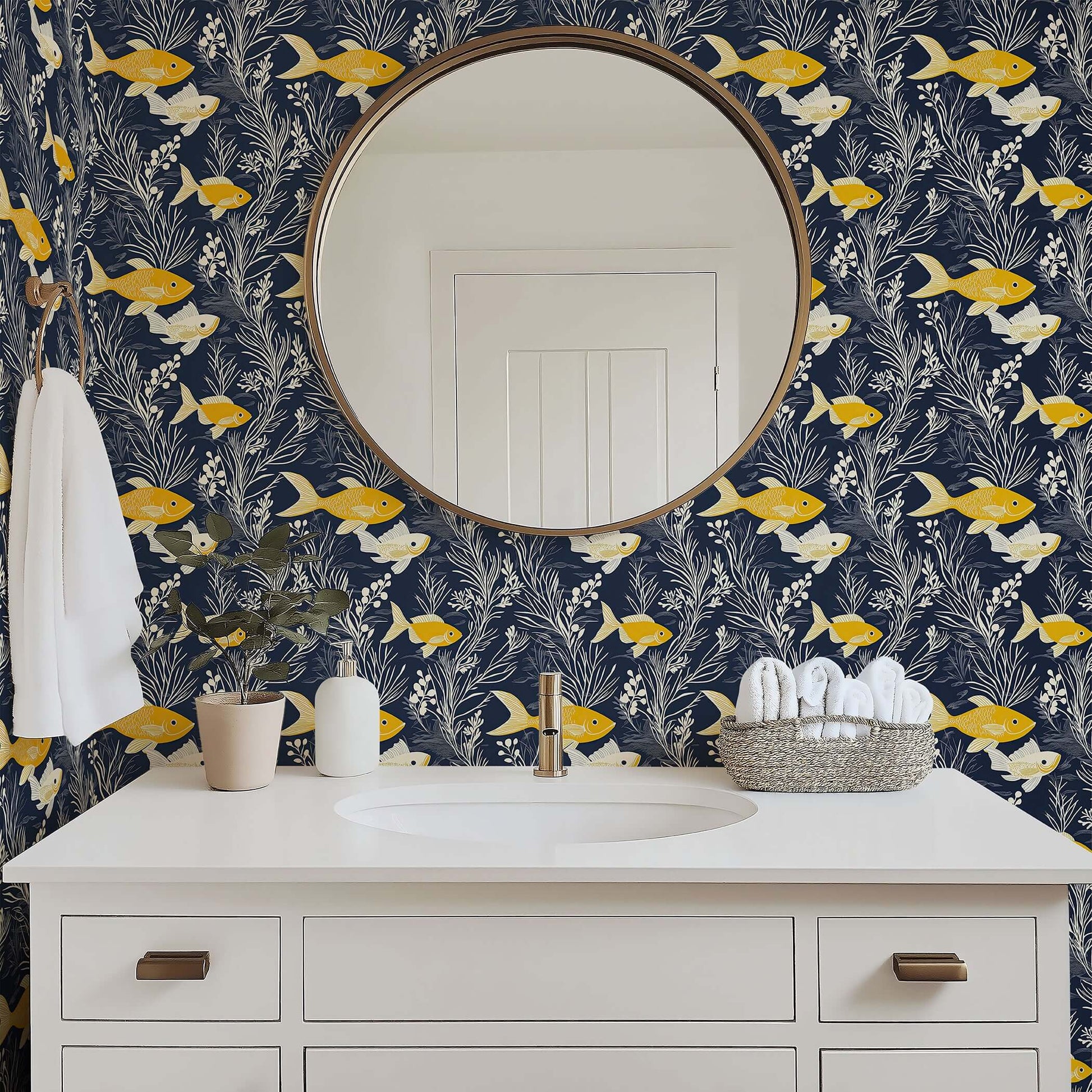 Ocean-themed coastal wallpaper with golden yellow fish and white seaweed on navy blue, perfect for beach house bathrooms.