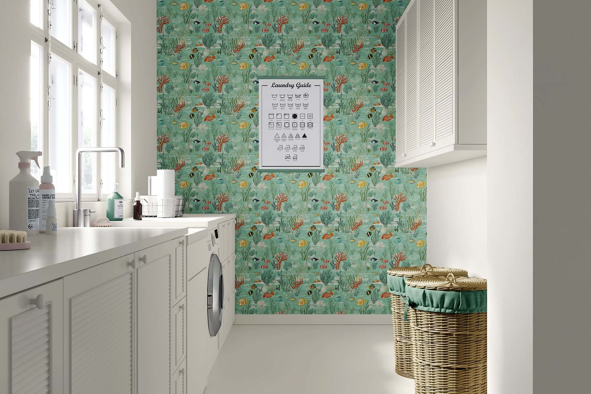 Coastal laundry room with ocean-themed "Serene Fish Garden" wallpaper featuring fish, coral, and seaweed on a seafoam green background.