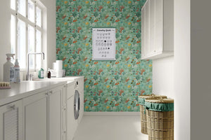 Coastal laundry room with ocean-themed "Serene Fish Garden" wallpaper featuring fish, coral, and seaweed on a seafoam green background.