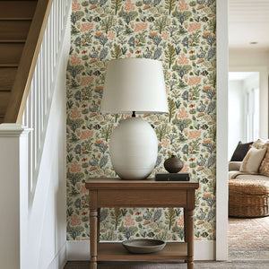 Coastal-themed wallpaper with hand-drawn coral, seaweed, and fish in earthy tones, featured in a serene interior setting.