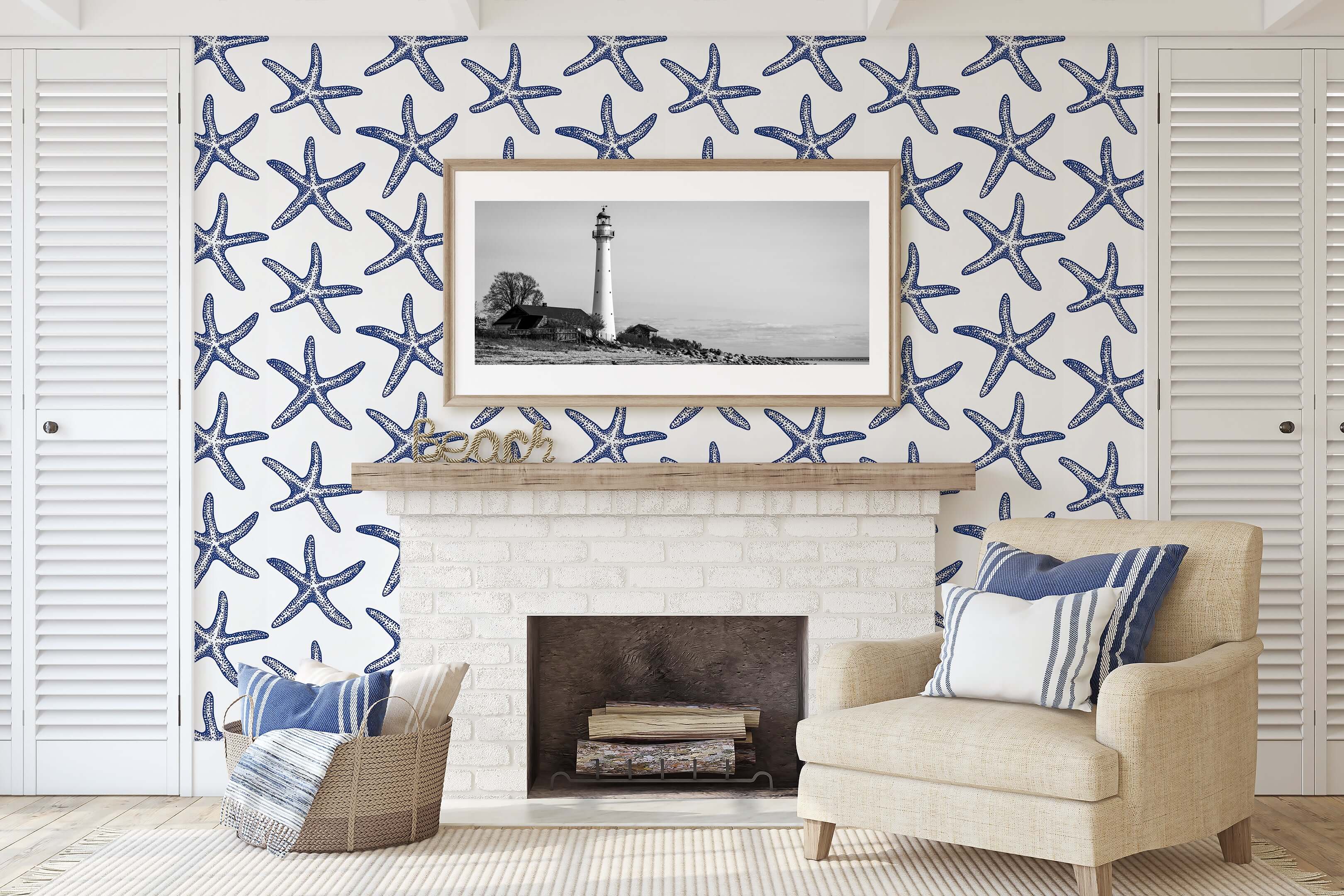 Coastal living room with Seaside Stars wallpaper, featuring blue starfish on white, for a modern beach-inspired design.