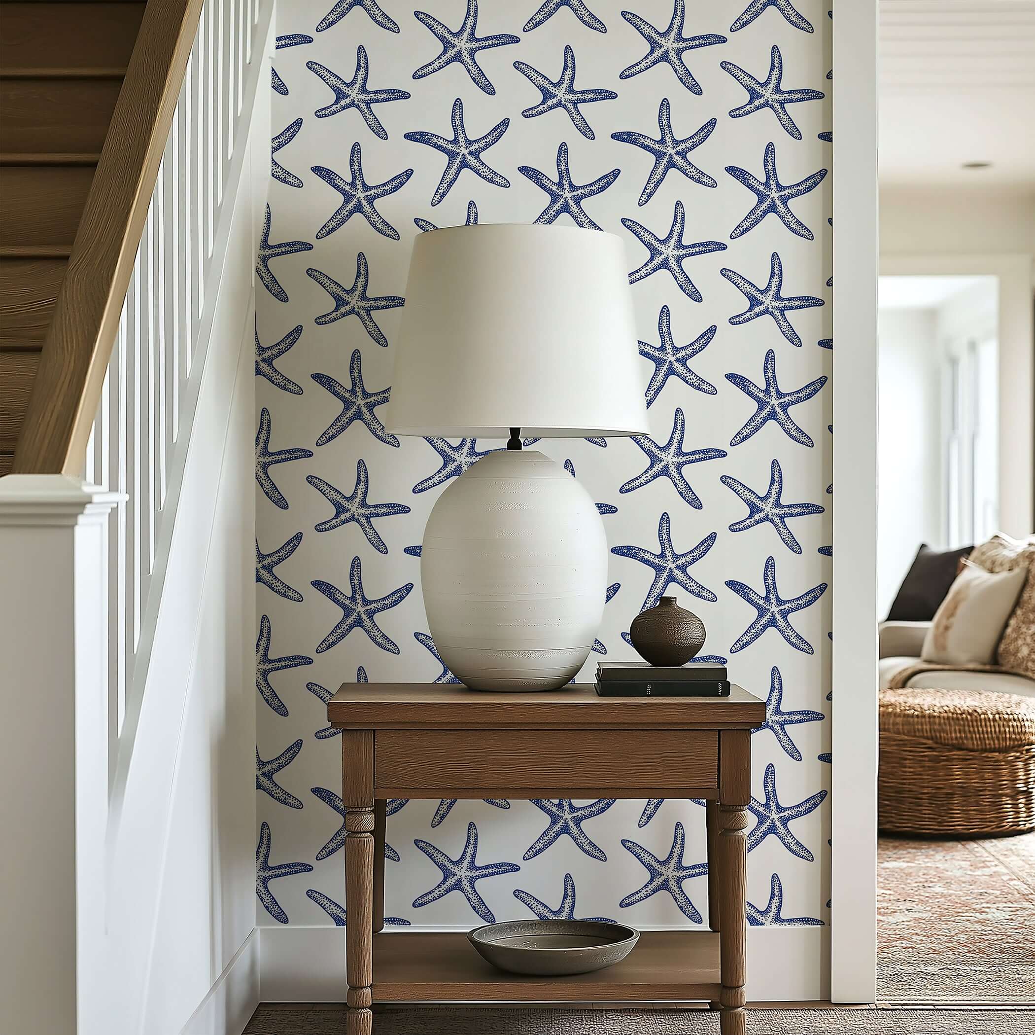 Coastal wallpaper with blue starfish design on white background, perfect for modern beach-themed decor