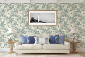 Coastal wallpaper featuring hand-drawn tropical fish and coral in seafoam hues for a vintage marine design atmosphere.