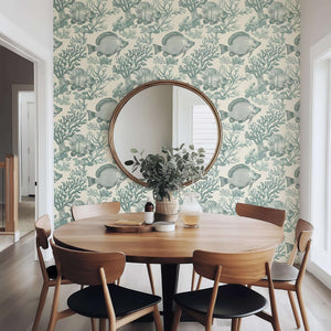 Ocean Classics wallpaper with vintage fish and marine illustrations in a coastal-themed dining room.