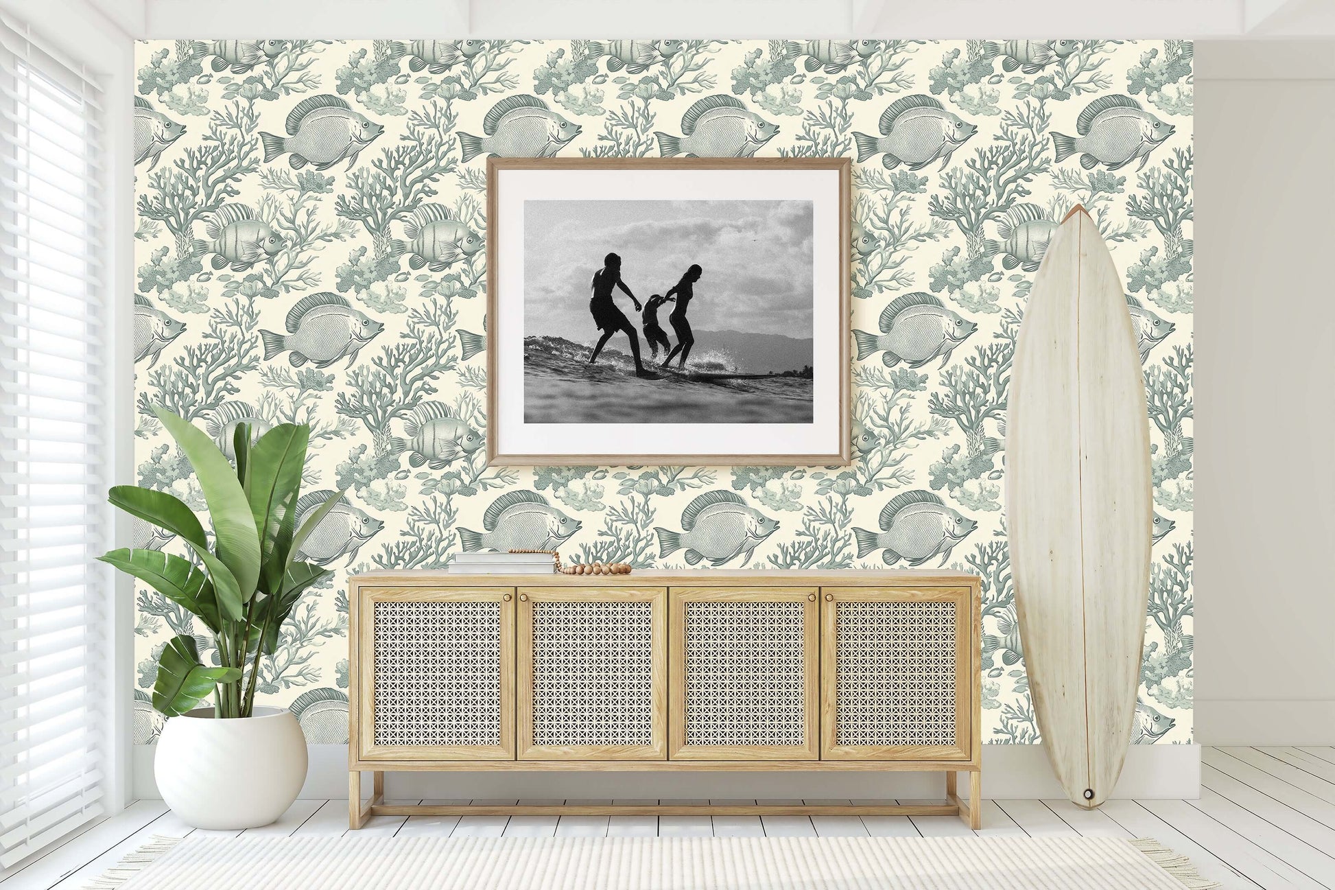 Elegant coastal wallpaper with vintage fish design enhancing a beach-themed room, featuring surfboard and framed picture.