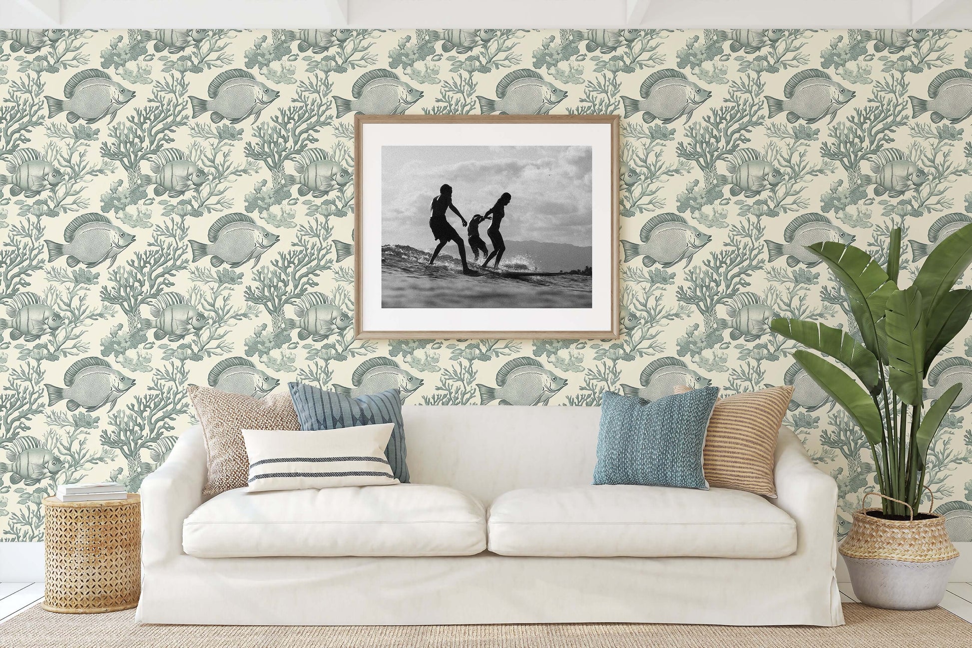 Coastal-themed living room with Ocean Classics wallpaper featuring fish and coral patterns, enhancing a vintage marine ambiance.