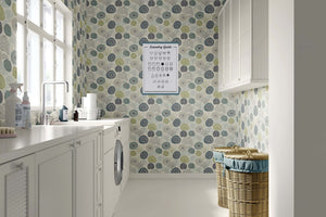 Seabed Chic coastal wallpaper featuring coral and sea urchin designs, adding modern elegance to a bright laundry room.
