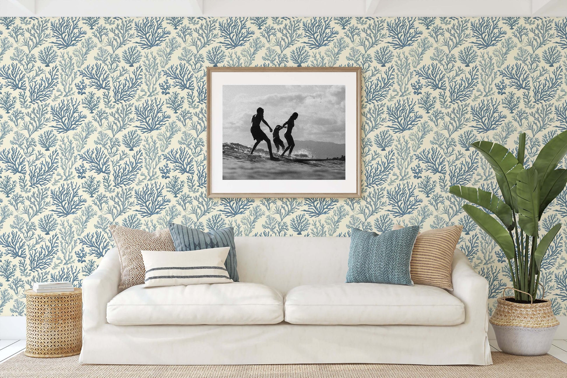 Living room featuring Marine Retreat coastal wallpaper with coral and ocean design in blue tones, modern decor accents.