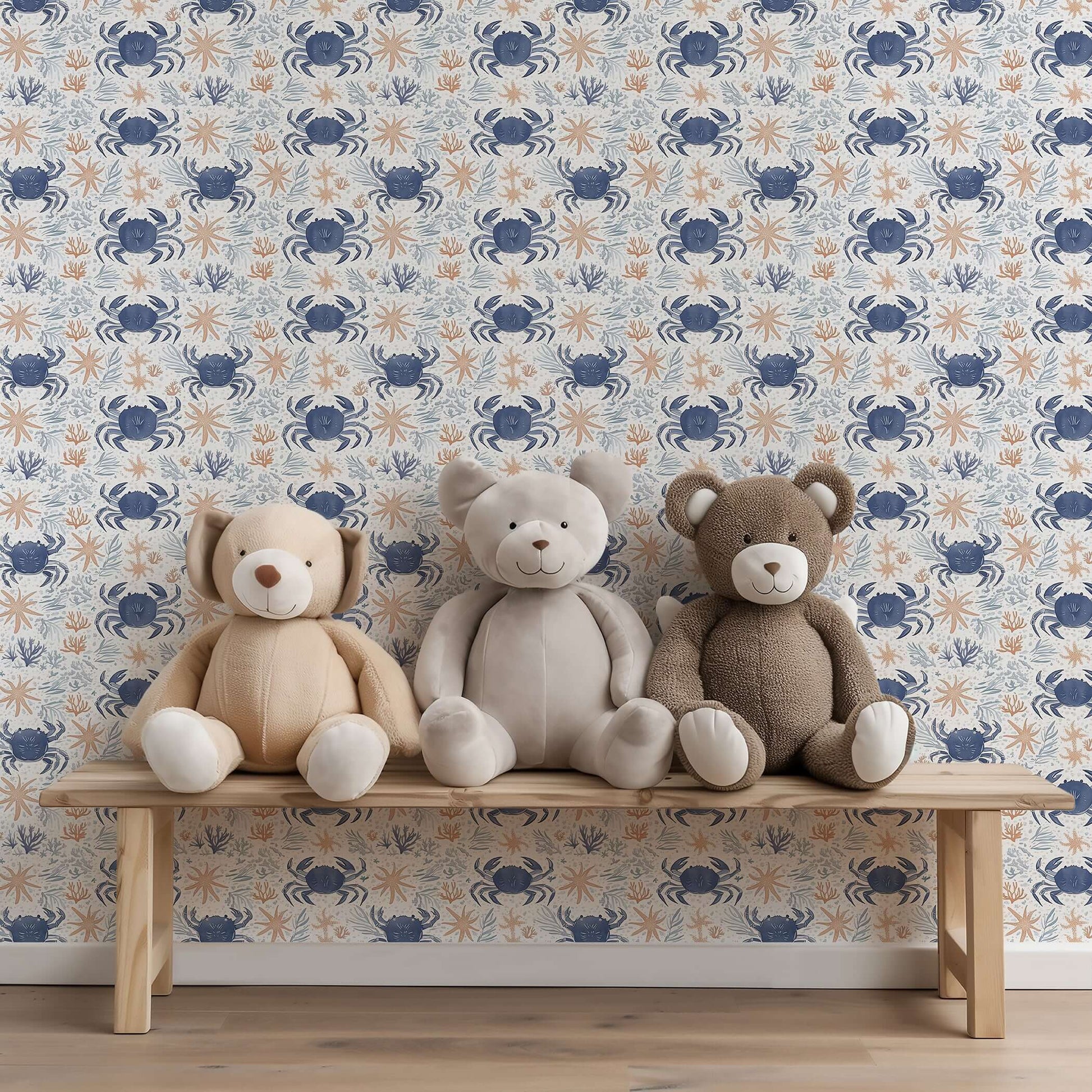 Coastal Crawlers wallpaper with blue crabs and starfish behind a bench of plush teddy bears, ideal for ocean-themed decor.