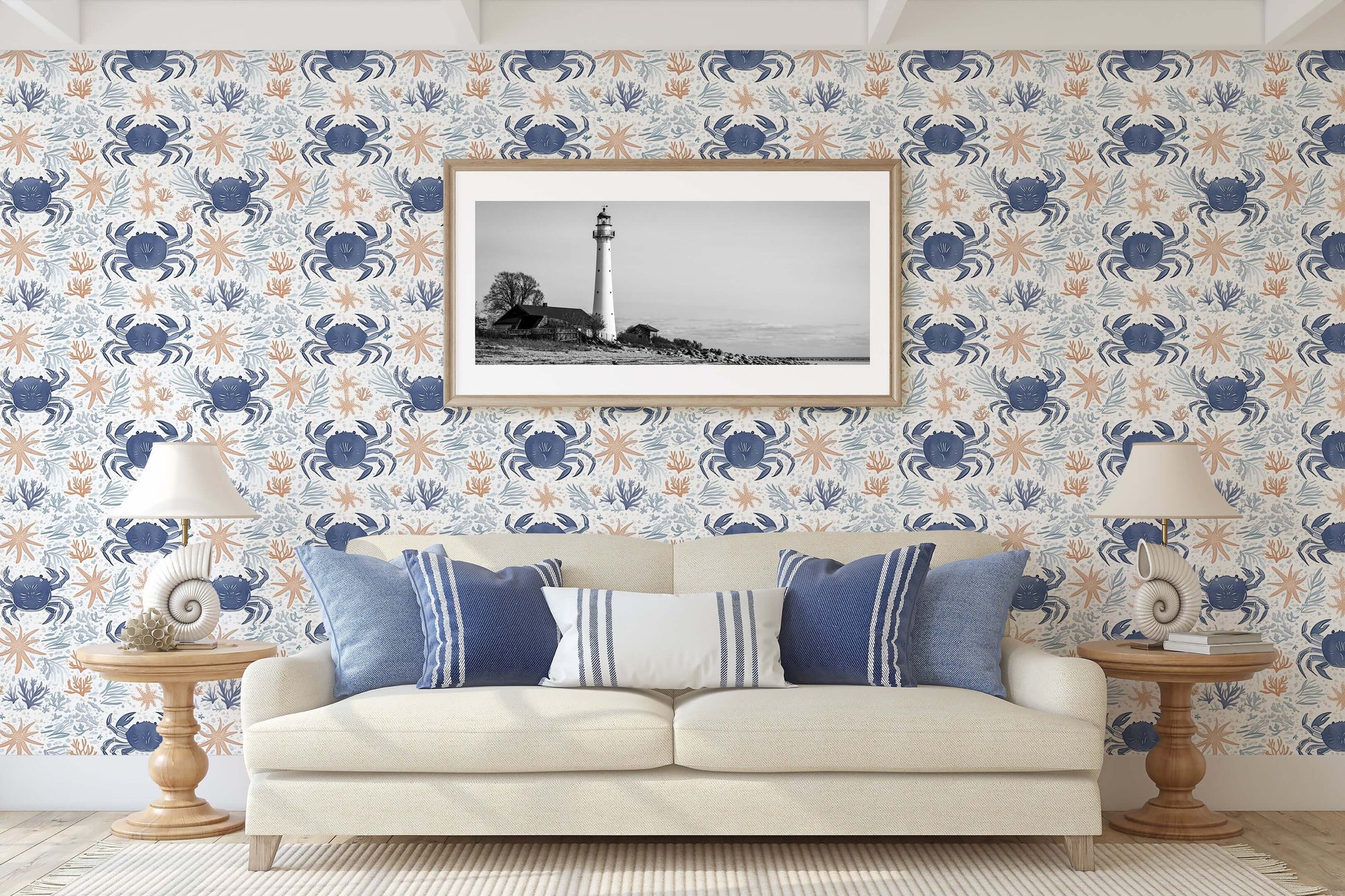 Living room featuring Coastal Crawlers wallpaper with blue crabs, starfish, and coral accents enhancing a coastal ocean theme.