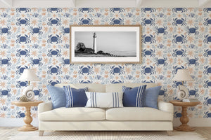 Living room featuring Coastal Crawlers wallpaper with blue crabs, starfish, and coral accents enhancing a coastal ocean theme.