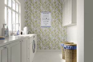 Modern laundry room featuring Seaweed Flow wallpaper in green and taupe, enhancing coastal and ocean-inspired aesthetics.