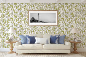 Modern coastal living room with "Seaweed Flow" wallpaper in green and taupe, enhancing ocean-inspired design with natural elegance.