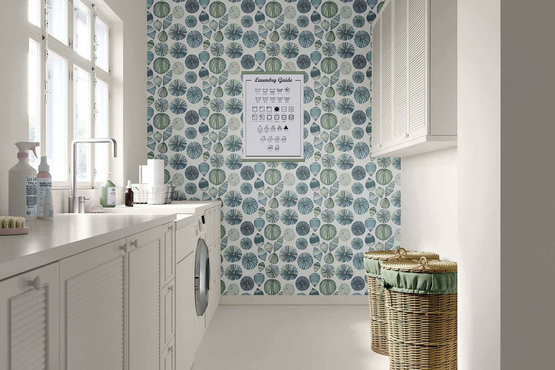 Coastal wallpaper with sea urchins and seashells in aqua, jade, and ocean blues adds beach charm to modern laundry room décor.