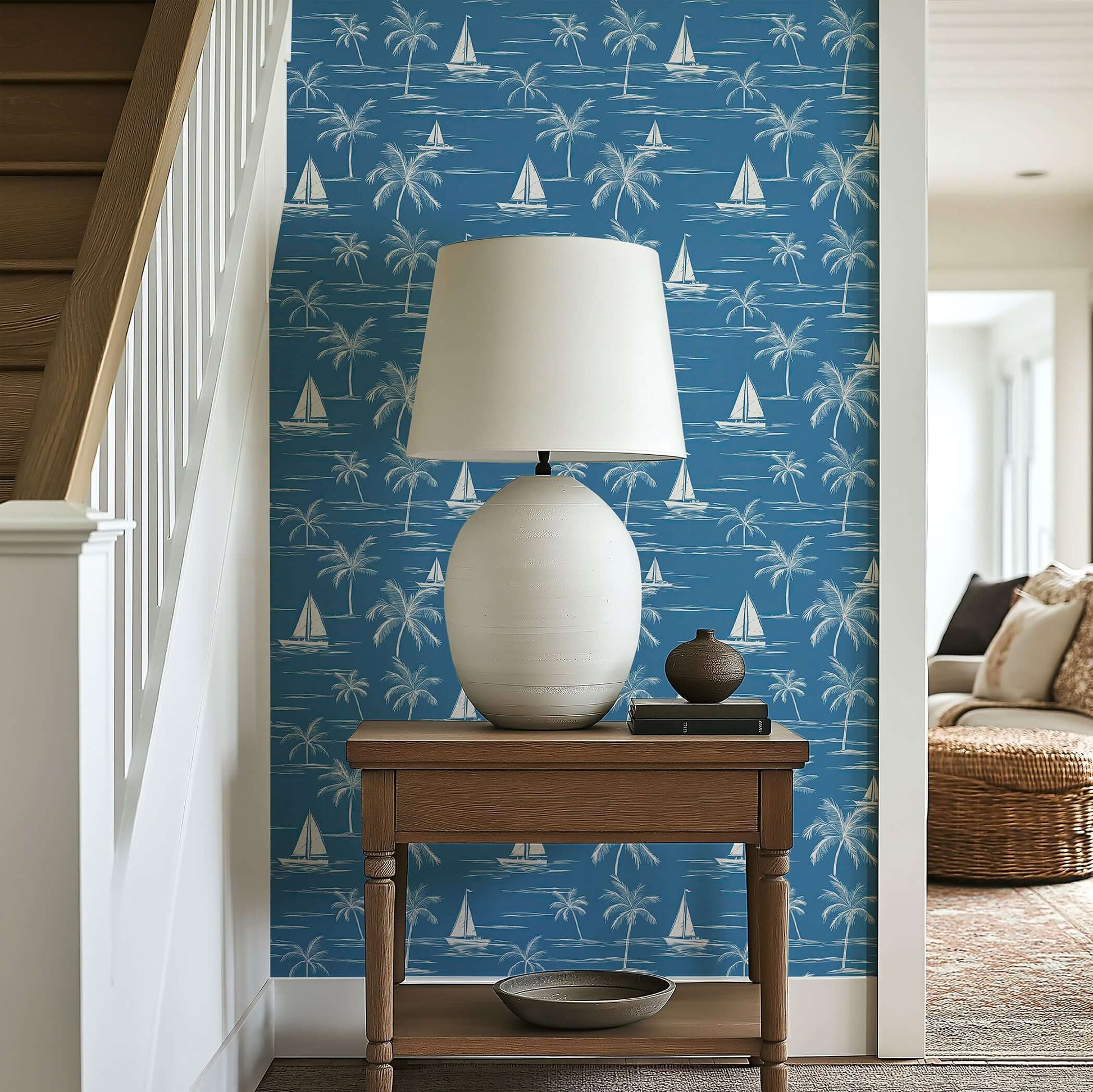 "Sail and Palm" wallpaper featuring sailboats and palm trees in a blue oceanic design, adding coastal charm to interior decor.