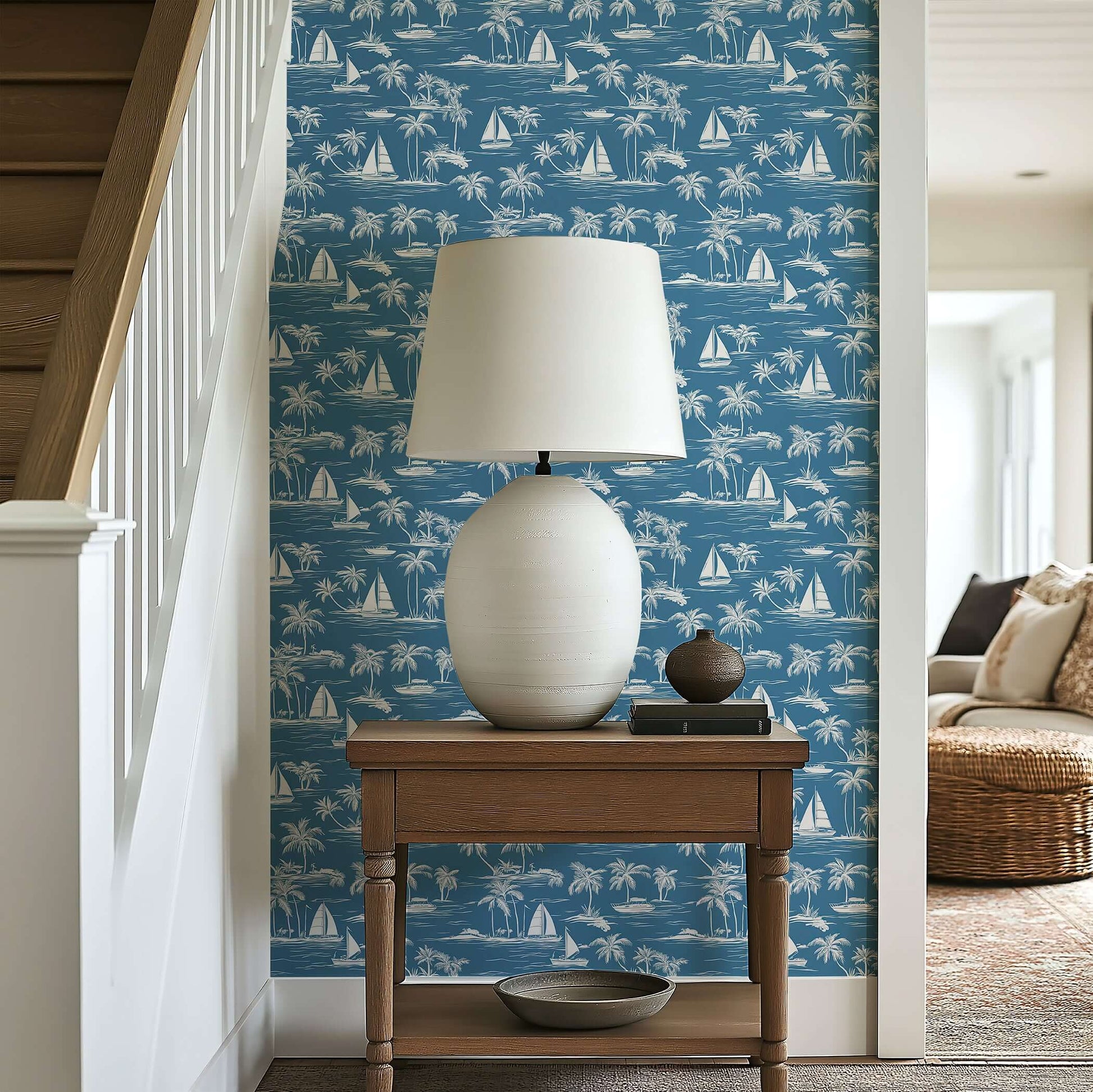 Toile "Sail Away" coastal wallpaper with sailboats and palm trees enhancing a nautical-themed room with serene, elegant design.