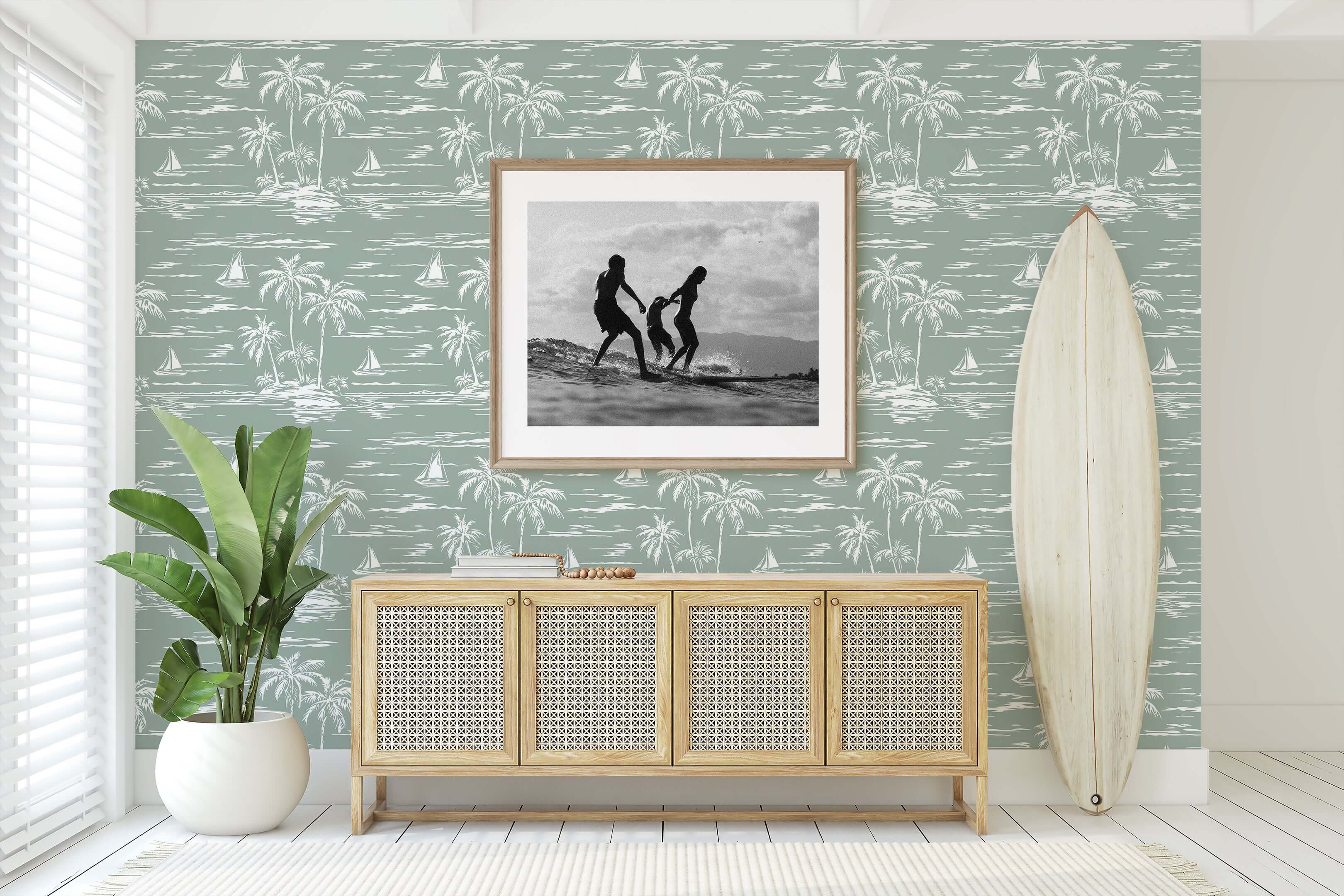 Palm Coastline wallpaper with palm trees and boats in a coastal-themed room, featuring a surfboard and framed photo, enhancing oceanic vibes.