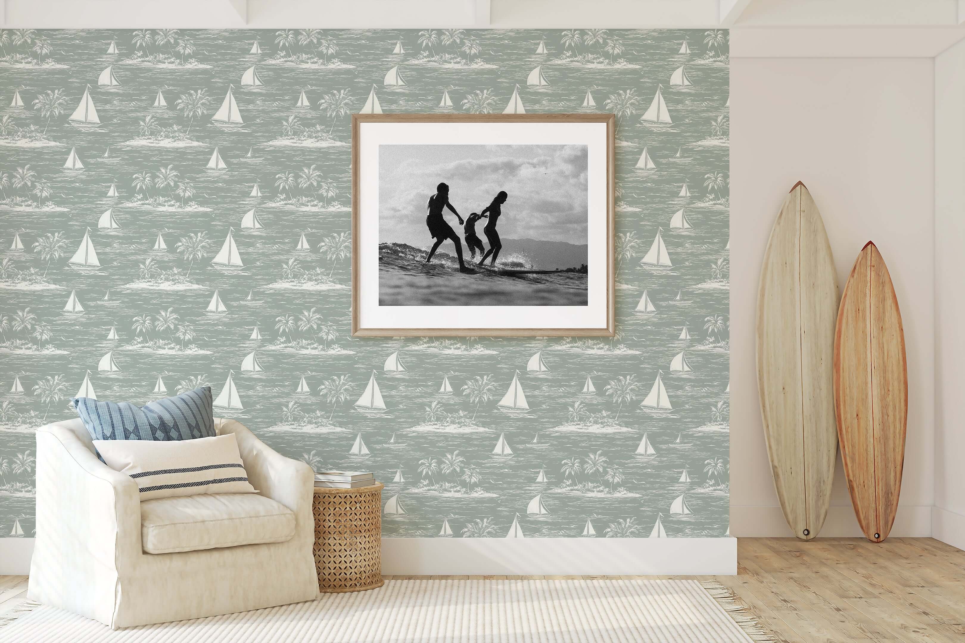 Harbor Calm wallpaper with sailboats and palm trees in coastal room featuring surfboards and armchair, ideal for nautical decor.