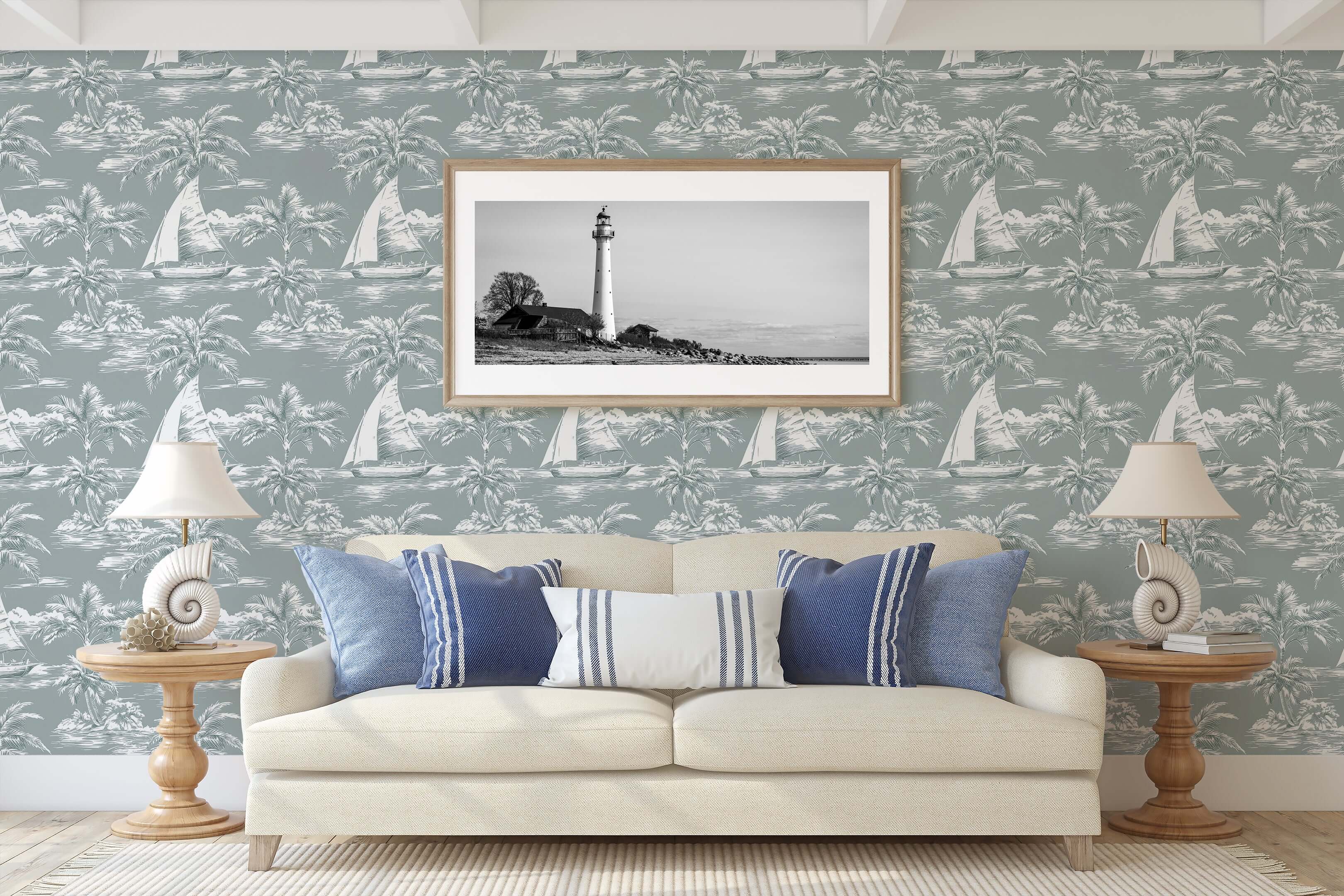 Room with Coastal Dreamscape wallpaper featuring boats, palm trees, and a framed lighthouse picture, embodying coastal elegance.