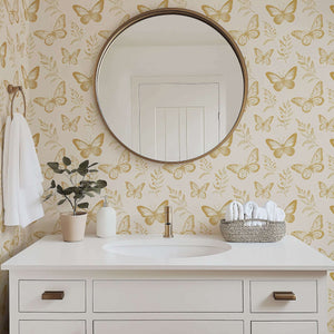 Elegant bathroom featuring "Golden Flight" wallpaper with metallic gold butterflies, ideal for nursery and modern floral design lovers.
