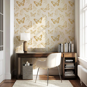 Golden Flight wallpaper with gold butterflies and botanical sprigs in a modern room, perfect for nursery or playroom elegance.