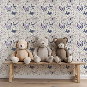 Butterfly Garden Dreams wallpaper featuring lilac butterflies and florals behind plush bears, ideal for a children's nursery or playroom.